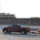 Illustration for article titled Towing A Race Car With A Small House: The Silverado 2500 High Country